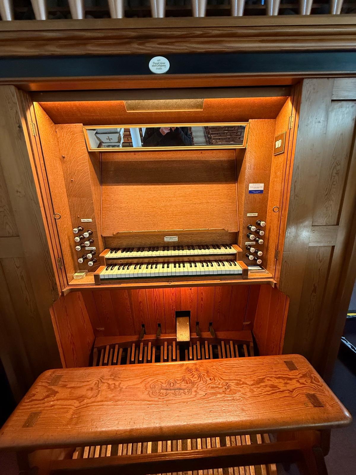 Pipe organ console with stop knobs — tuning and maintenance service